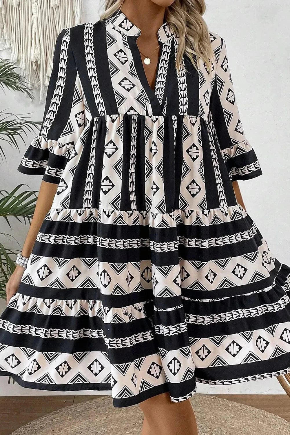 Printed tiered dress with notched sleeves